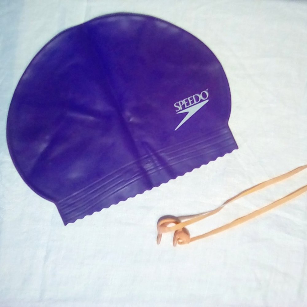 Free with purchase, Speedo swim cap and a nose clip